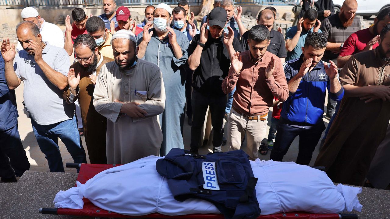 Palestinians attend the funeral of a journalist working for Al-Aqsa radio. The journalist was killed when an Israeli strike hit his home north of Gaza City, on May 19.