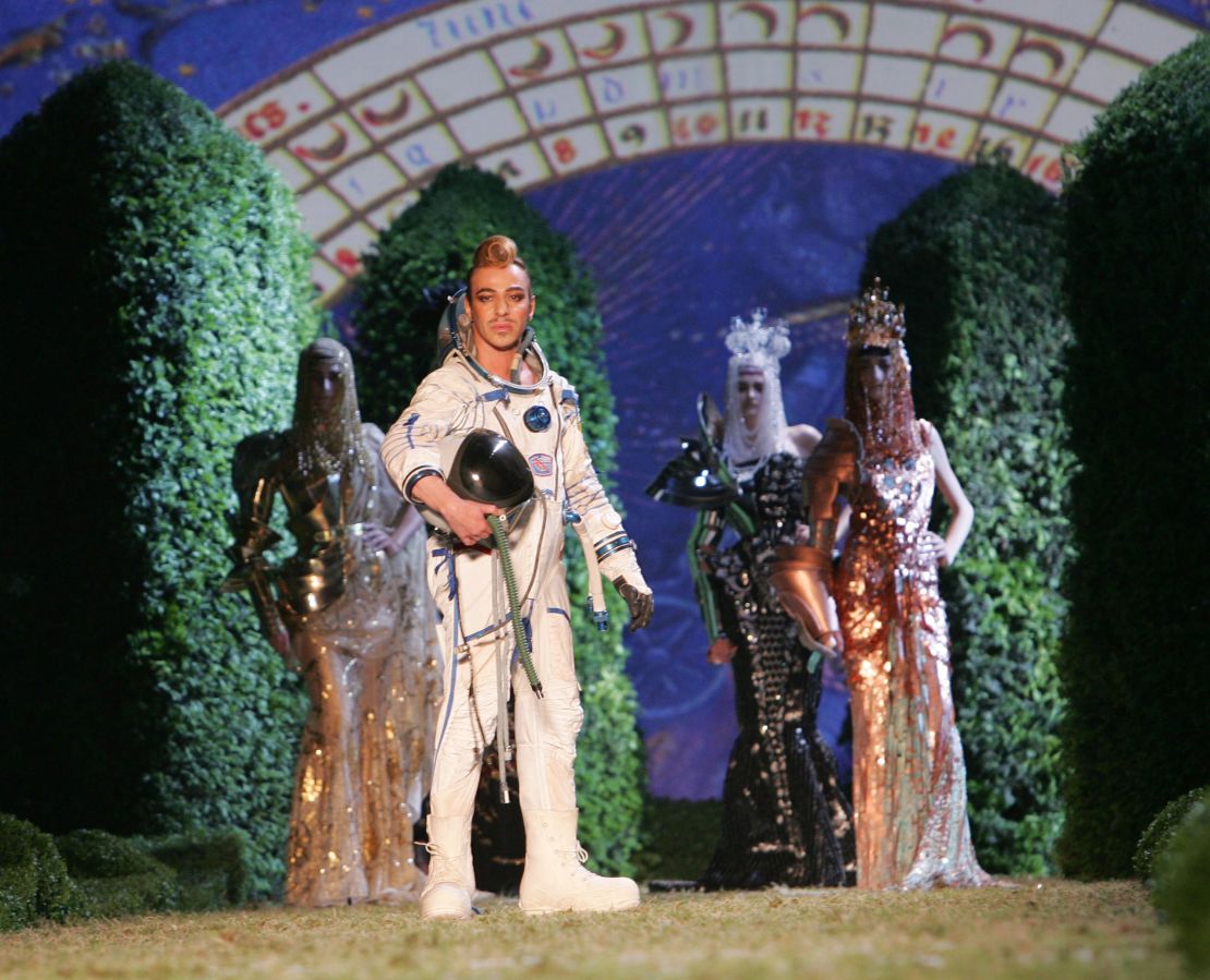 John Galliano took his bow while wearing a Dior Haute Couture spacesuit in 2006.