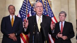Senate Minority Leader Mitch McConnell (R-KY), joined by Senate Assistant Minority Leader John Thune (R-SD) (L) and Senate Minority Whip Roy Blunt (R-MO), speaks following a Senate Republican Policy luncheon at the Russell Senate Office Building on May 18, 2021 in Washington, DC. 