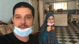 Musa Abu Askar and Rasha Abu Askar are pictured in their home in Gaza. Both have tested positive for the coronavirus and have sent their four children to their grandparents' home to ensure they don't also get sick.