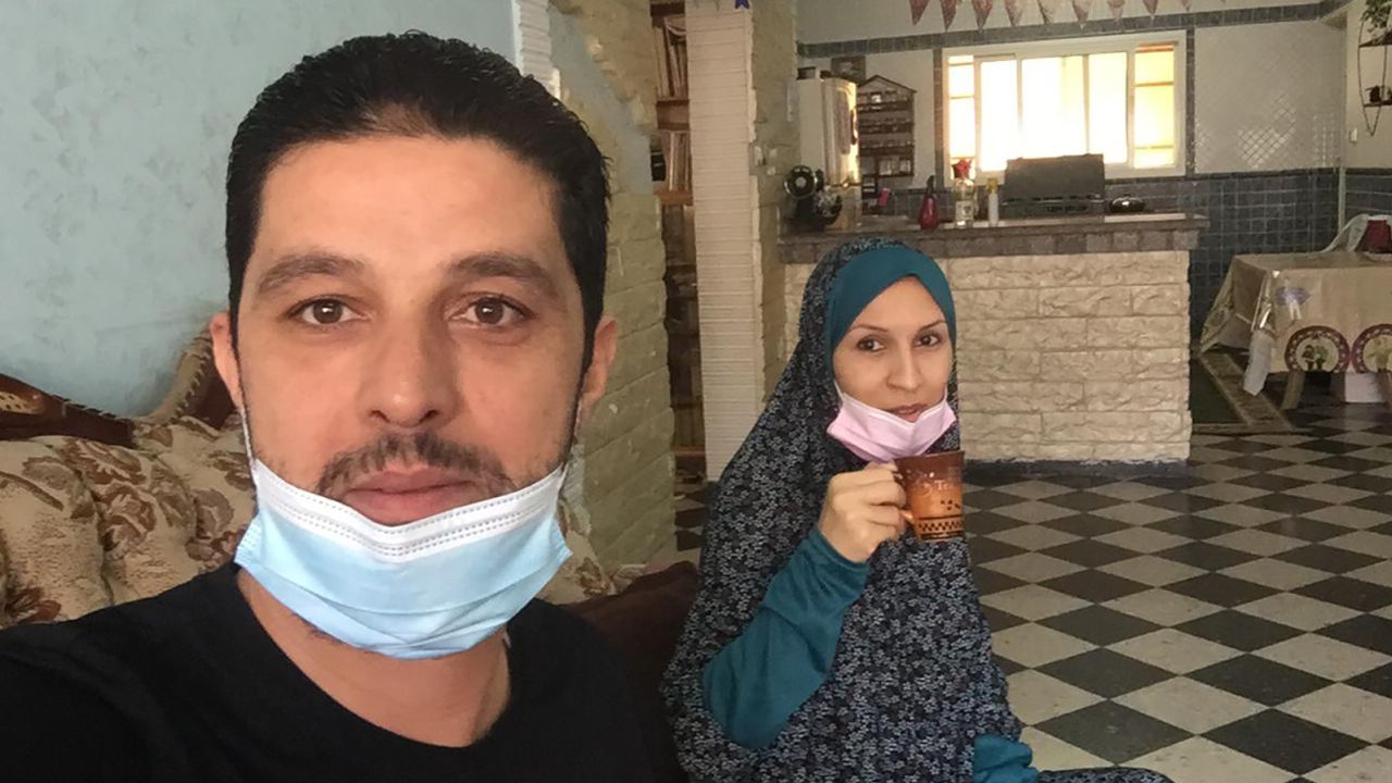 Musa Abu Askar, left, and Rasha Abu Askar in their home in Gaza. Both tested positive for the coronavirus just before violence flared. 
