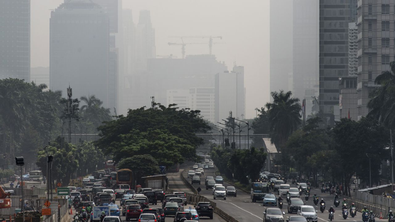 Buildings in downtown Jakarta are shrouded in a thick haze made worse by fires burning in rural provinces around the region on February 23, 2018. 