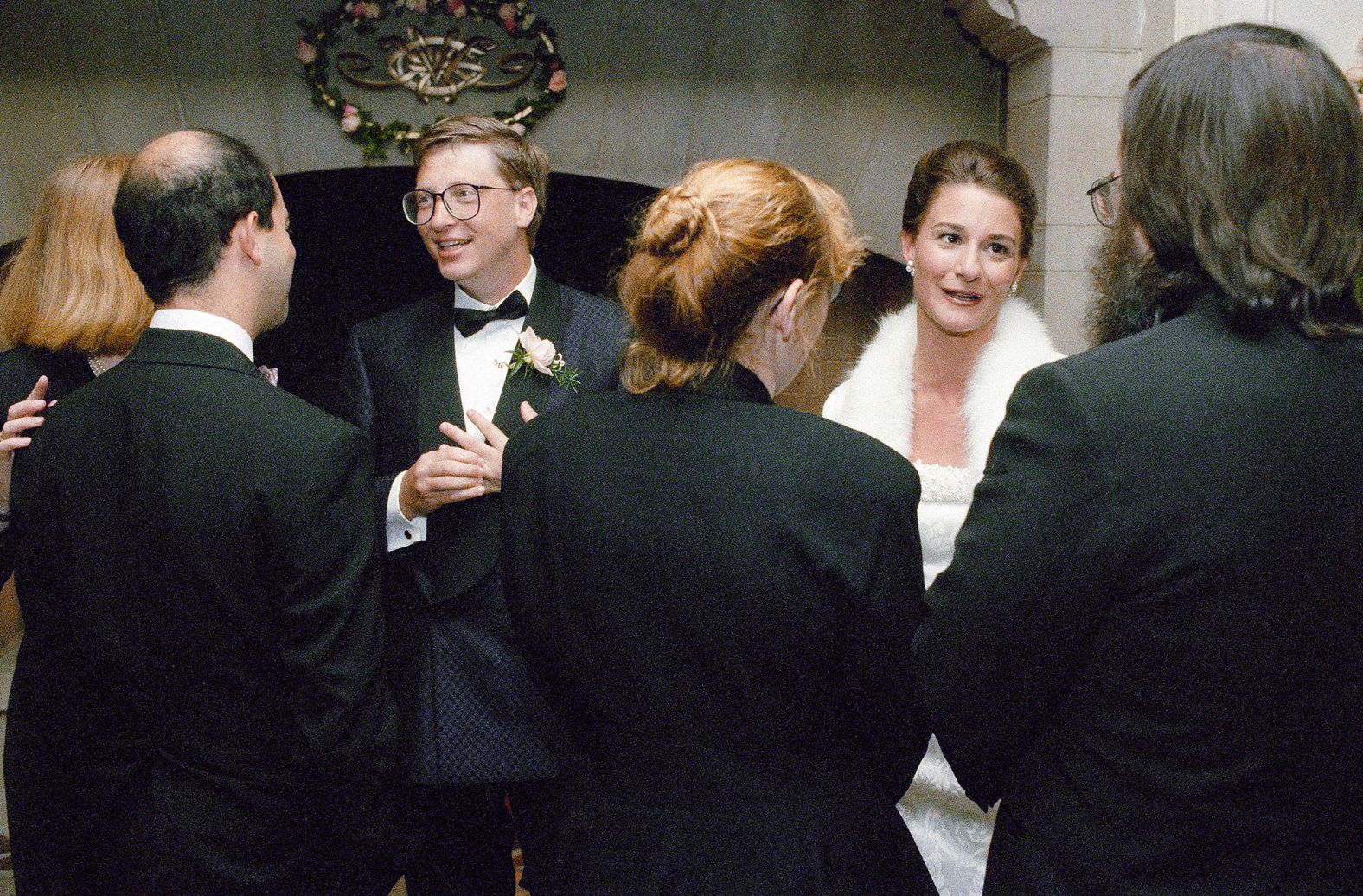 Gates and his wife, Melinda, greet guests during a reception in Seattle in 1994. It was a week after they were married in Hawaii. The two met at Microsoft. She started as a product manager as the only woman in the first class of MBA graduates to join the company. She eventually rose through the ranks to become general manager of information products.