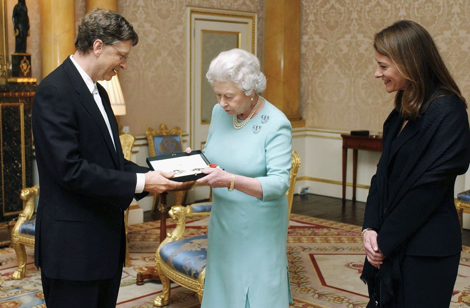 The Gateses meet with Britain's Queen Elizabeth II in 2005. Bill was awarded an honorary knighthood in recognition of his outstanding contributions to enterprise and to poverty reduction.