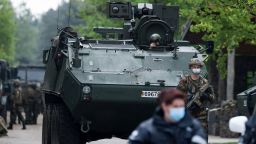 Belgian soldiers park a tank at an entrance of Nationaal Park Hoge Kempen in Maasmechelen, Northern Belgium, on May 20, 2021. - Police stepped up a manhunt for a Belgian soldier with suspected extreme-right views and access to rocket launchers who went missing after threatening public figures -- including a renowned coronavirus expert. (Photo by Kenzo TRIBOUILLARD / AFP) (Photo by KENZO TRIBOUILLARD/AFP via Getty Images)