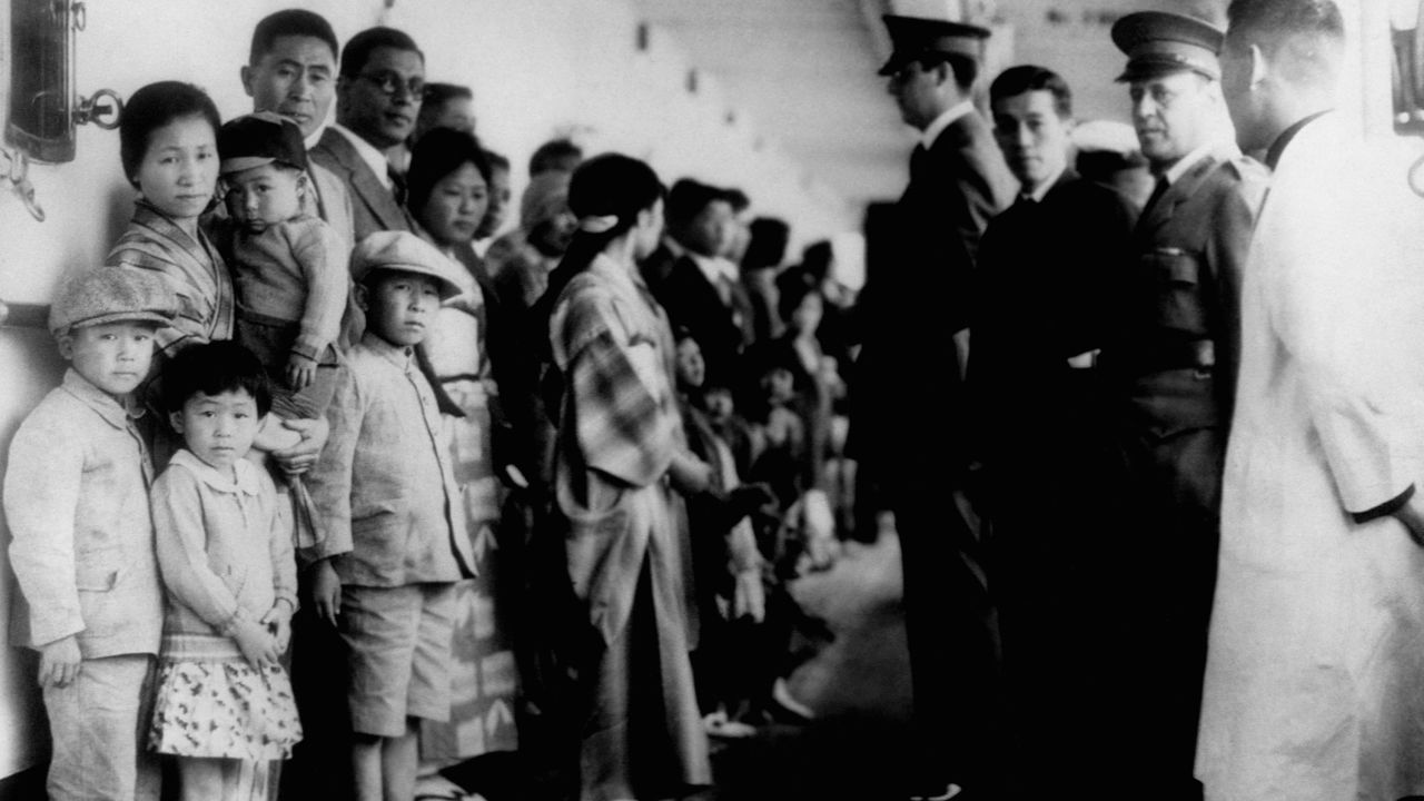 Immigration officials examine Japanese immigrants in 1931 aboard a ship on Angel Island, California.