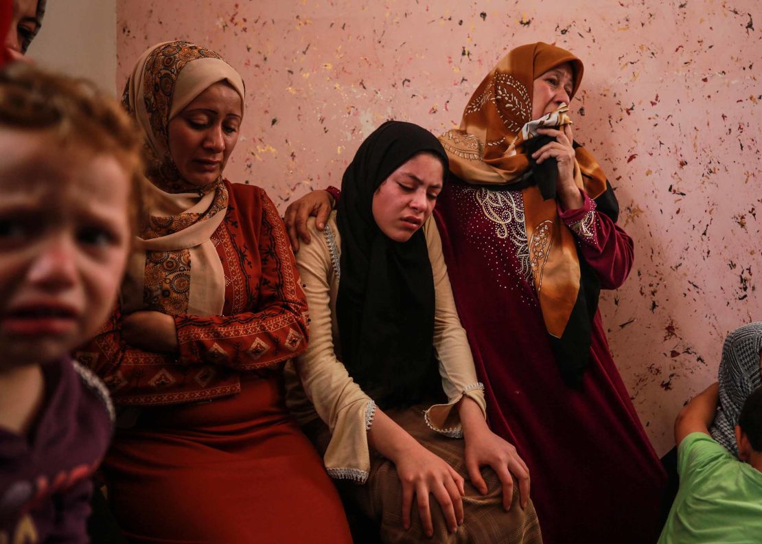 Relatives of 11-year-old Deema Asaliyeh, who was killed in an Israeli strike, mourn during her funeral ceremony at Jabalia refugee camp in Beit Lahia, Gaza on Thursday. 