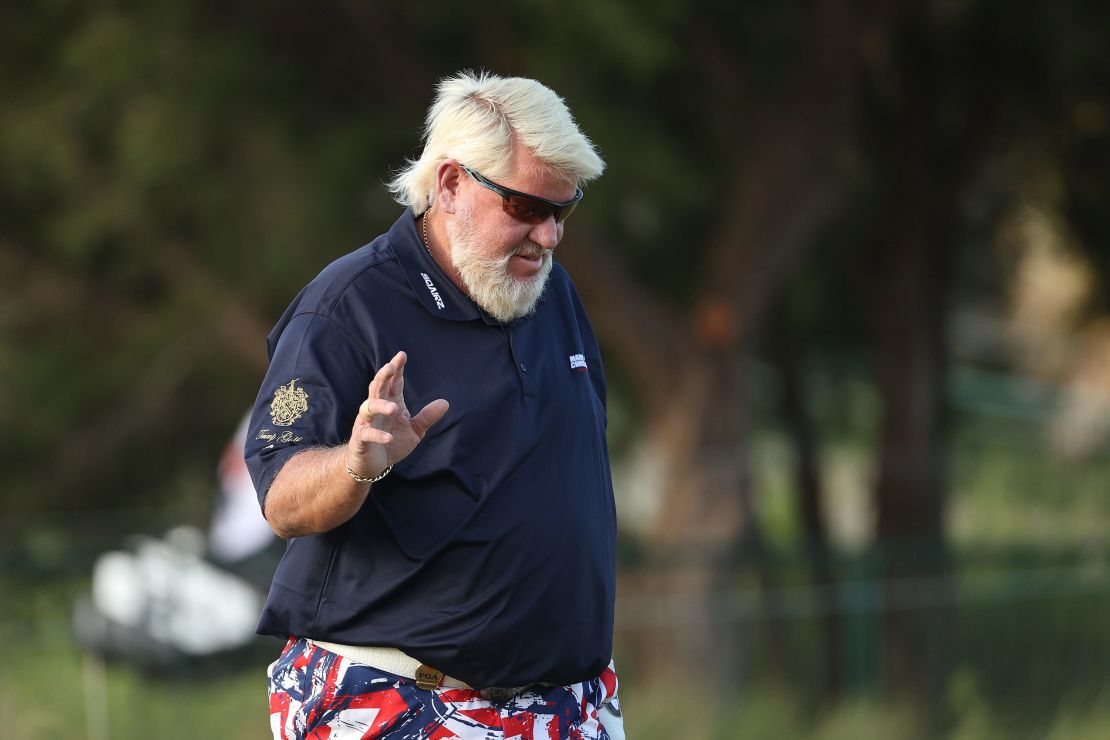 Daly reacts after playing his shot on the first hole out of the sand during the first round of the 2021 PGA Championship.
