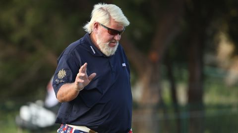 Daly reacts after playing his shot on the first hole out of the sand during the first round of the 2021 PGA Championship.