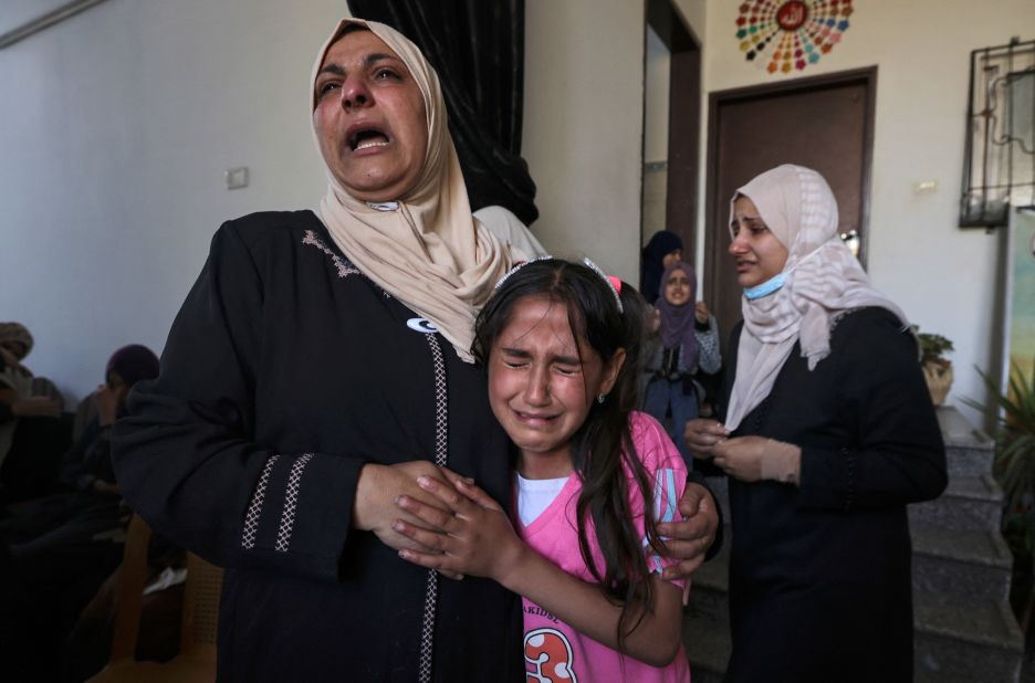 The relatives of Palestinian Mahmoud Shtawi, 19, react during his funeral in Gaza City on May 19. He was killed in an Israeli airstrike.