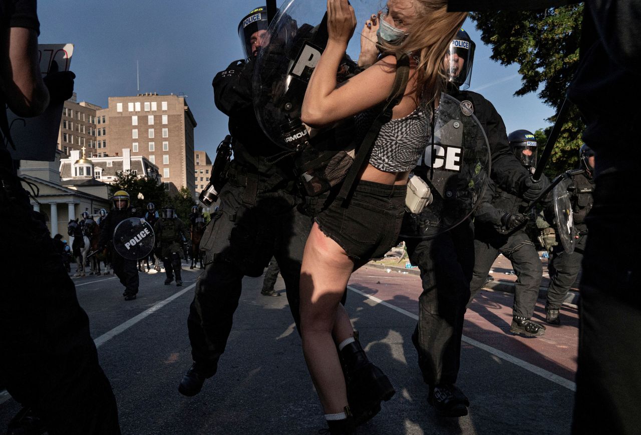 Riot police rush demonstrators in Lafayette Park on June 1.