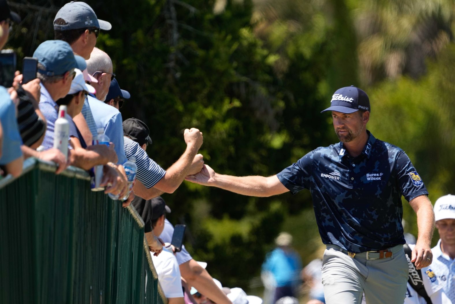 Webb Simpson greets fans as the walks to the second fairway during the first round on Thursday, May 20.