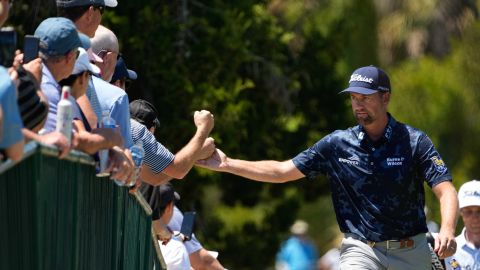 Webb Simpson greets fans as the walks to the second fairway during the first round on Thursday, May 20.