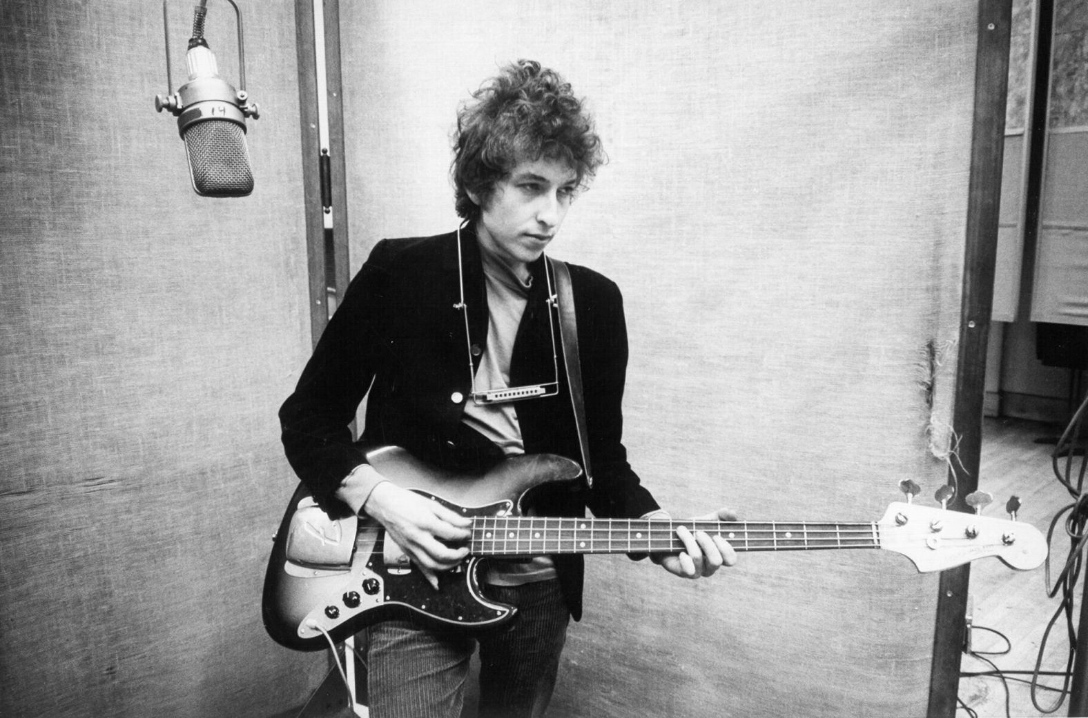 Dylan records his album "Bringing It All Back Home" in 1965. The album was a mix of acoustic and electric guitar. Dylan's move to electric was controversial at the time. Some fans wanted him to stick with the acoustic music they were used to hearing from him.