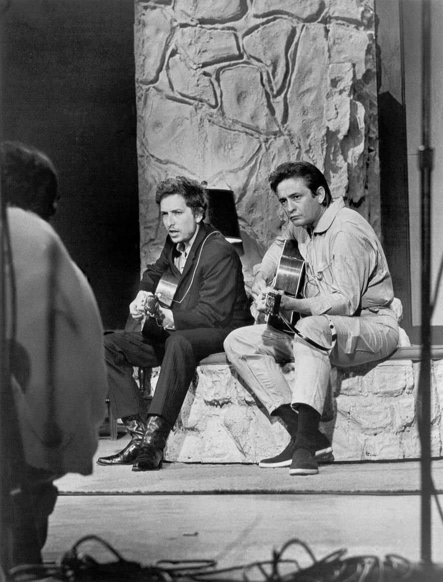 Dylan performs with country singer Johnny Cash on Cash's show in Nashville, Tennessee, in 1969.