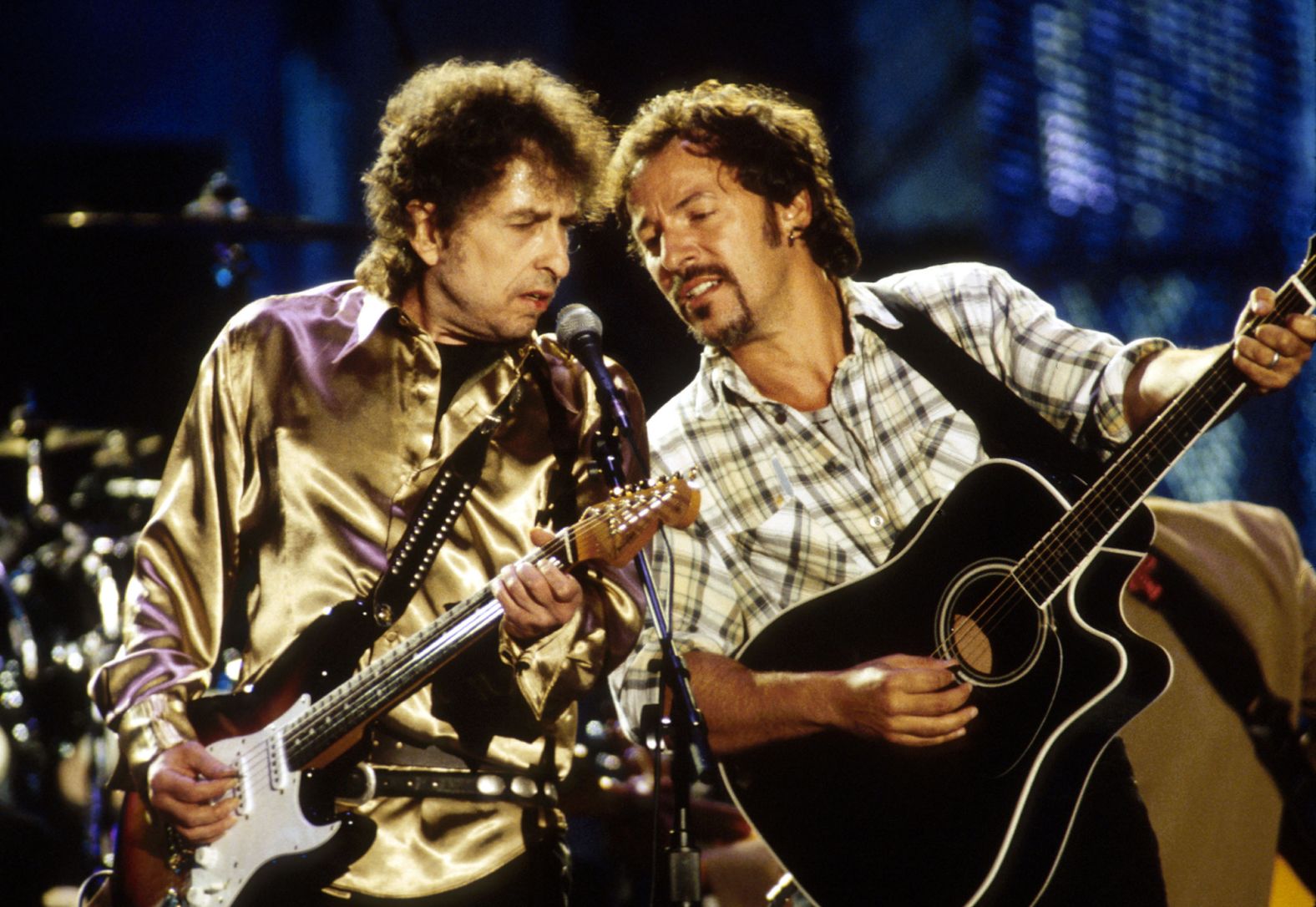 Dylan and Bruce Springsteen perform "Forever Young" at a concert for the Rock & Roll Hall of Fame in 1995.