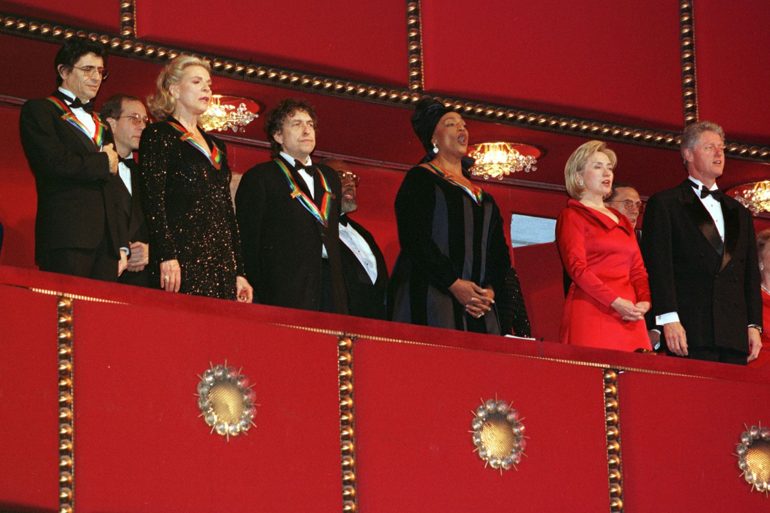 Dylan and other Kennedy Center honorees stand for the National Anthem with President Bill Clinton and first lady Hillary Clinton in 1997.