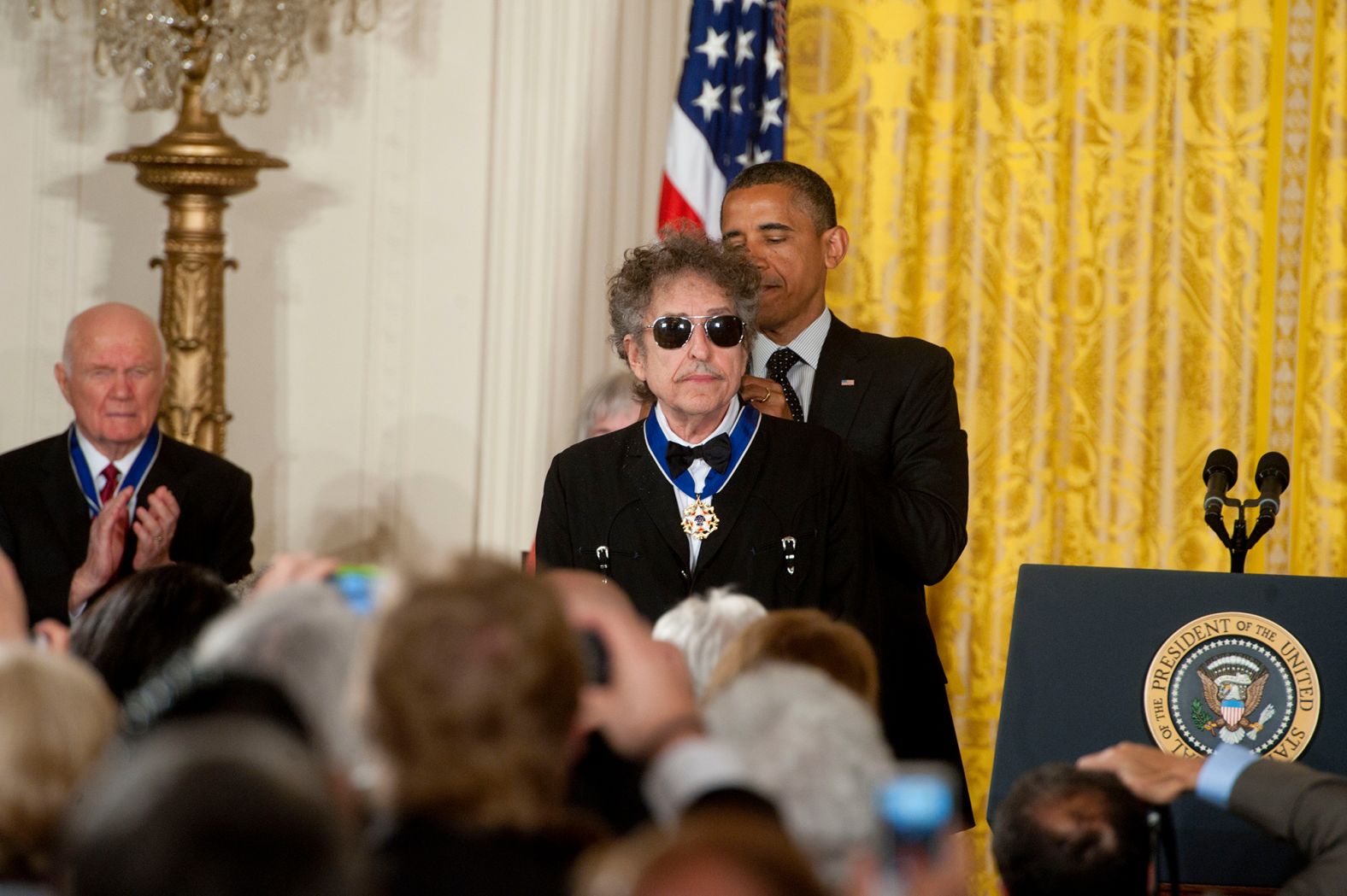 Dylan receives the Presidential Medal of Freedom from President Barack Obama in 2012. "I remember, you know, in college, listening to Bob Dylan and my world opening up, 'cause he captured something about this country that was so vital," Obama said.