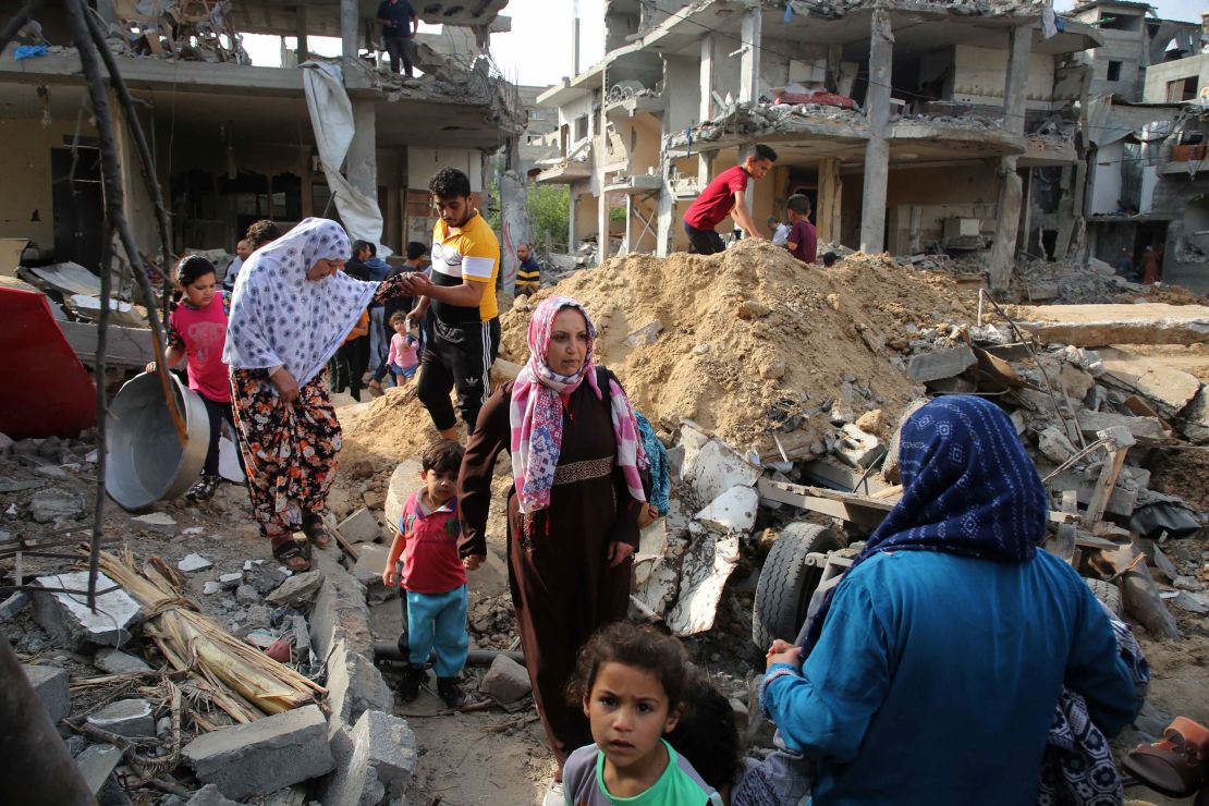 Palestinians return Friday to homes that were destroyed by Israeli airstrikes in Beit Hanoun, Gaza.