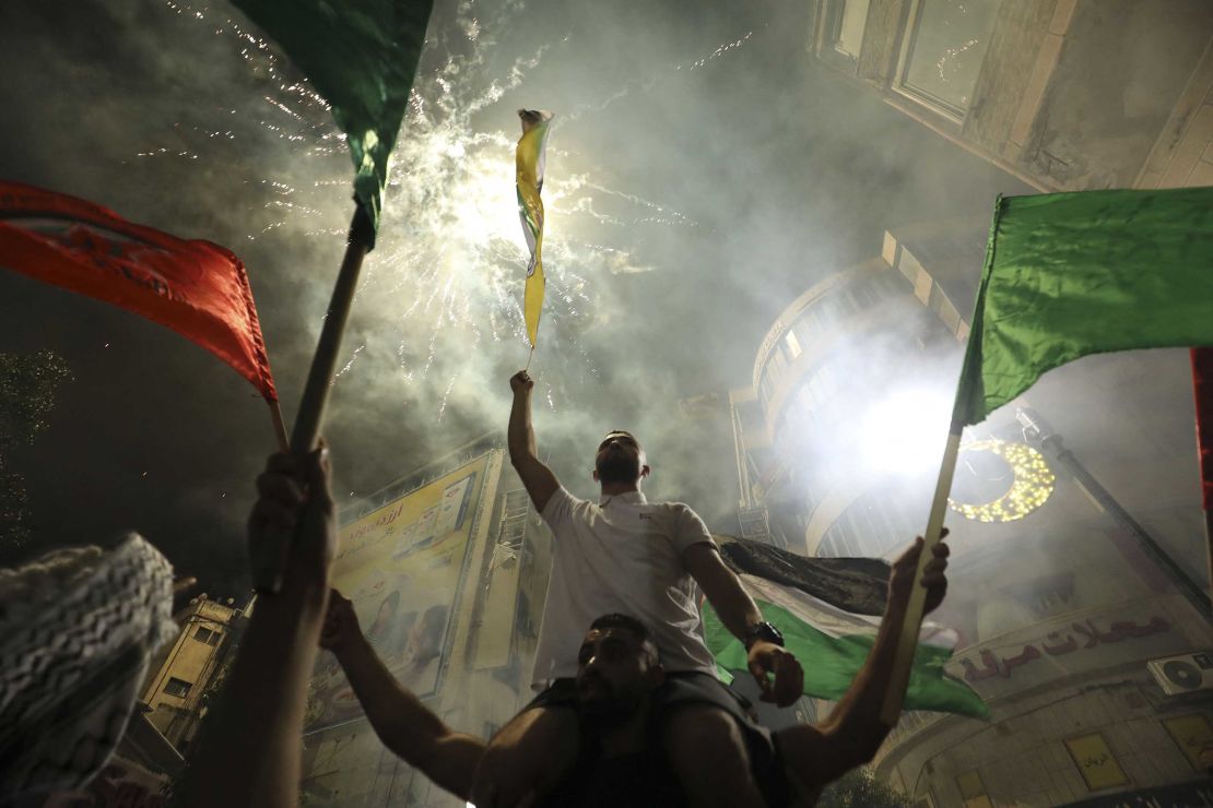 Palestinians celebrate in the West Bank city of Ramallah on Friday, after the ceasefire was agreed.
