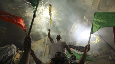 Palestinians celebrate in the West Bank city of Ramallah on Friday, after the ceasefire was agreed.