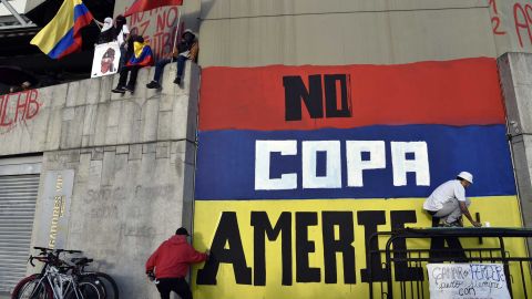 Street artists protest against Colombia being the host of Copa America on a wall of a stadium in May.