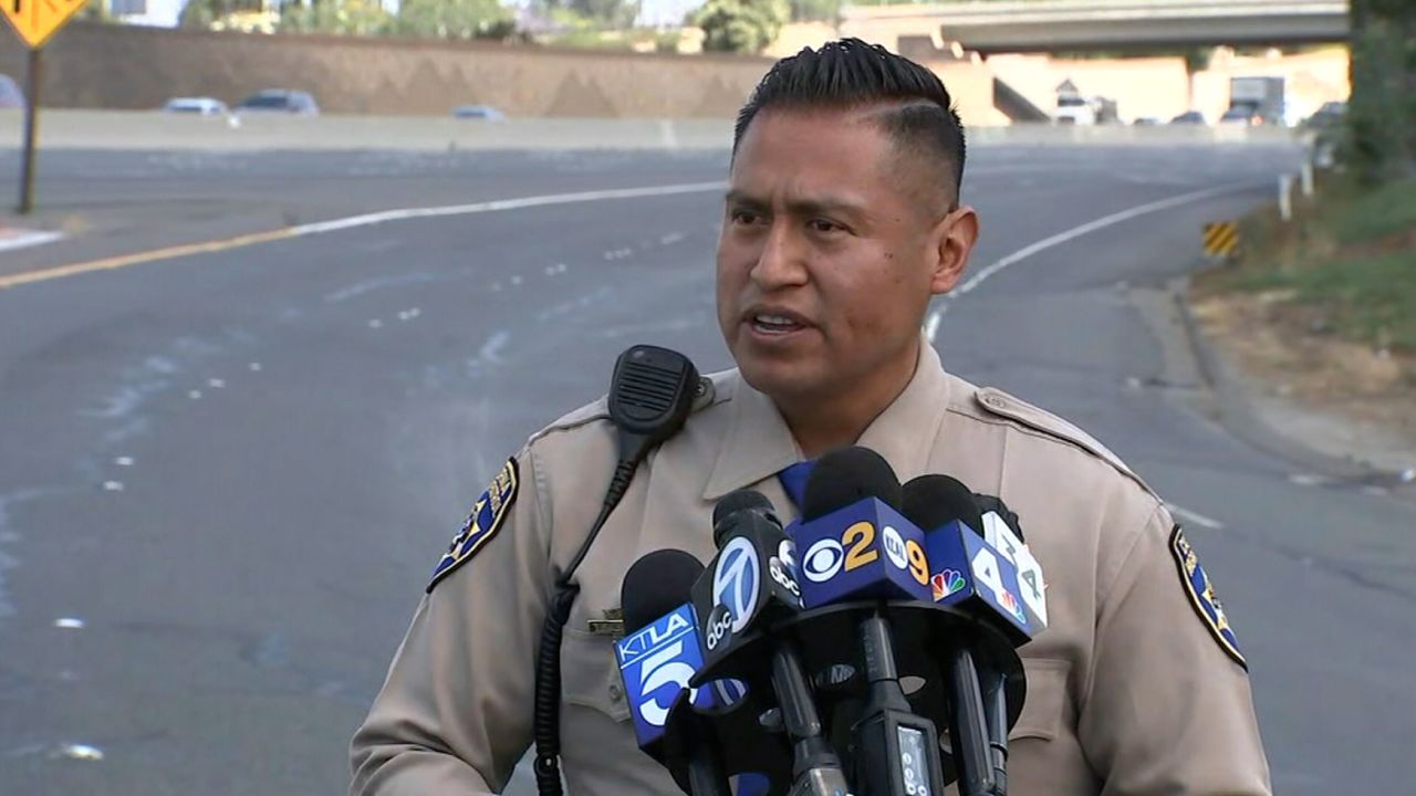 California Highway Patrol Officer Florentino Olivera answers questions from the news media about a road rage shooting that happened on the 55 Freeway in Orange County on Friday, May 21.
