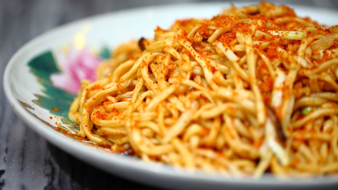 A plate of 102 House's braised, dried noodles with sole. 