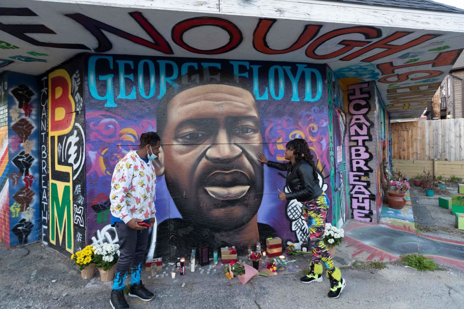 Shantel Carson and her son, Shavez Alston, pay their respects to Floyd at a memorial in Milwaukee on April 20.