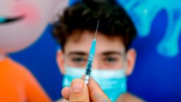 Michael, a 16-year-old teenager, receives a dose of the Pfizer-BioNtech COVID-19 coronavirus vaccine at Clalit Health Services, in Israel's Mediterranean coastal city of Tel Aviv on January 23, 2021. - Israel began administering novel coronavirus vaccines to teenagers as it pushed ahead with its inoculation drive, with a quarter of the population now vaccinated, health officials said. (Photo by JACK GUEZ / AFP) (Photo by JACK GUEZ/AFP via Getty Images)