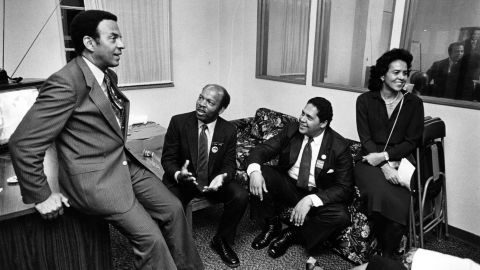 Mayoral candidate Andrew Young discusses the Atlanta election with John Lewis, Mayor Maynard Jackson and wife Jean Childs Young in 1981. 