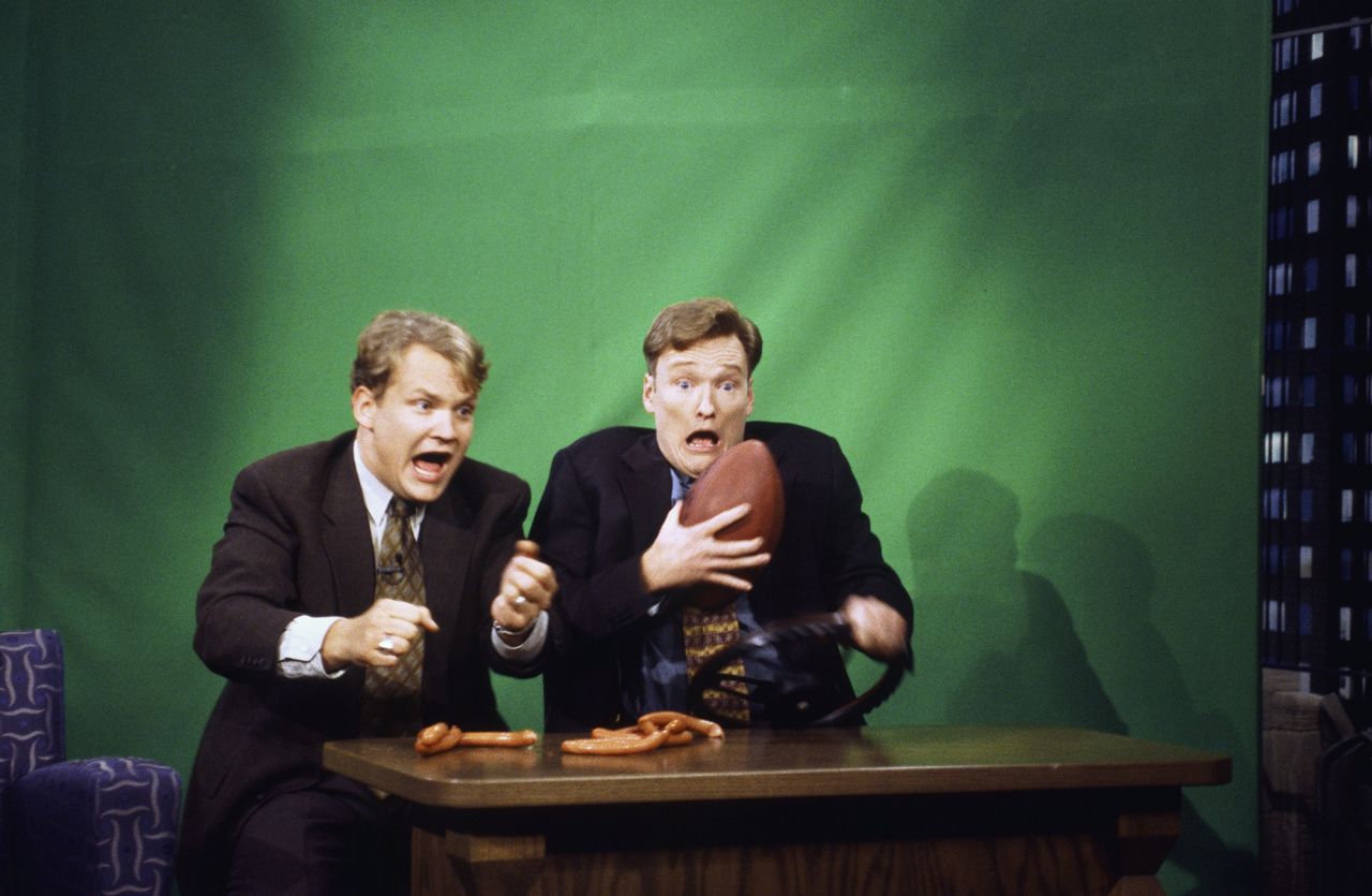 O'Brien does a skit with his longtime show sidekick, comedian Andy Richter, in 1996. Richter has been a part of O'Brien's show for much of his late-night run.