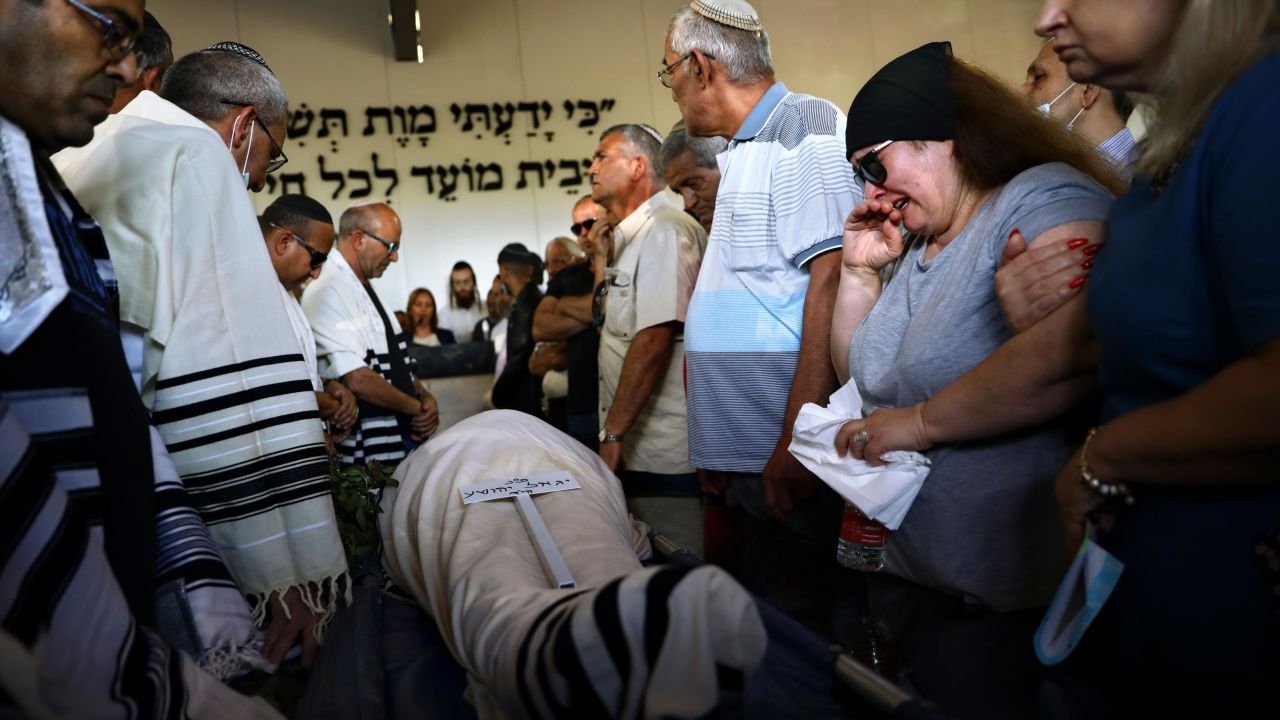 Mourners attend the funeral of Yigal Yehoshua on Tuesday.