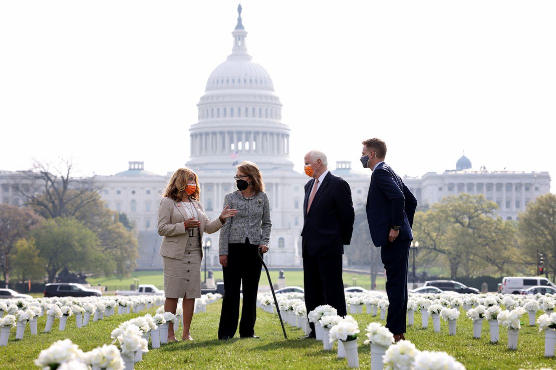 McBath joins former Rep. Gabby Giffords last month walking through an art installation of silk flowers representing the Americans killed each year due to gun violence.