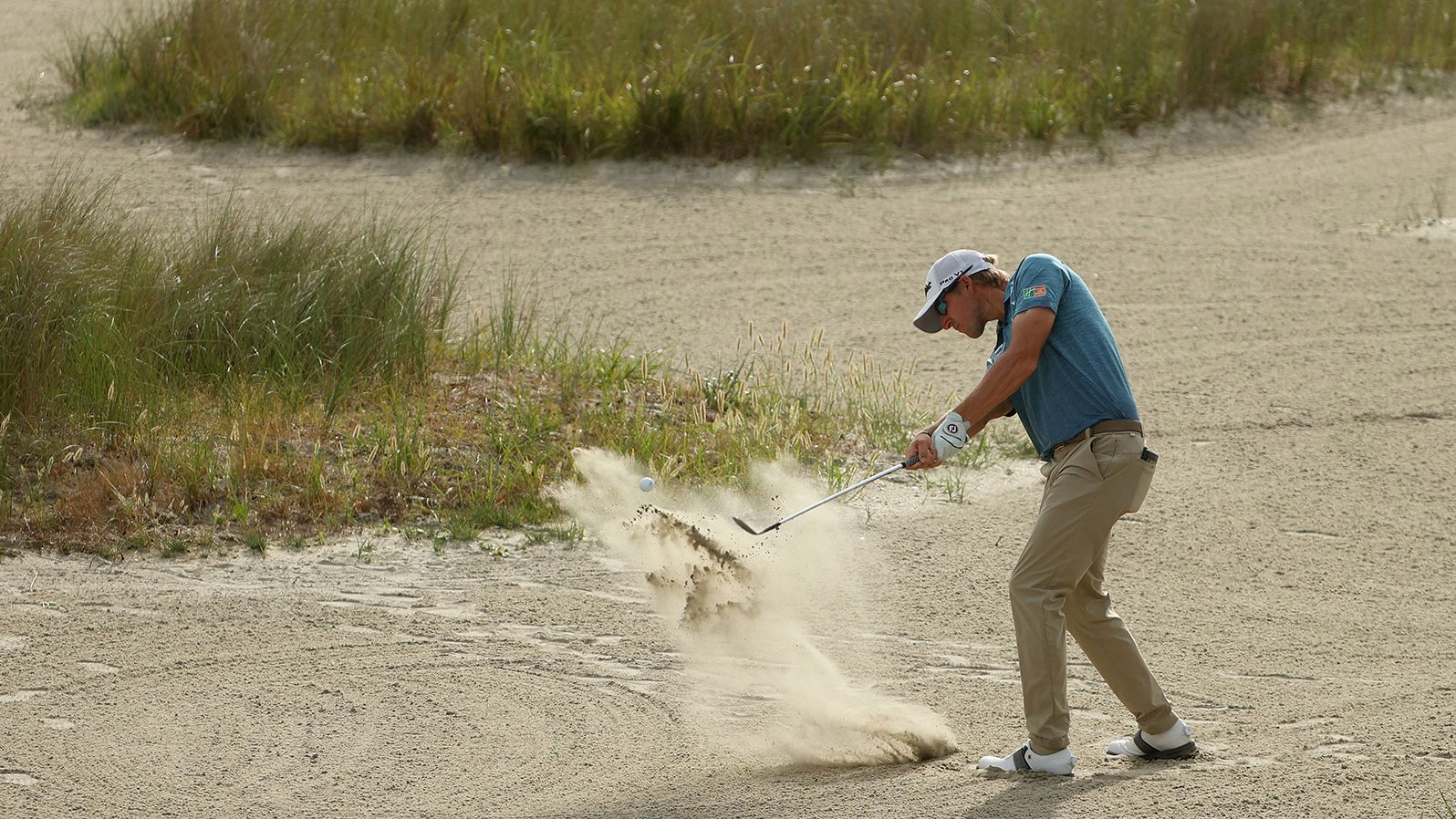 Richy Werenski plays a shot from the sand.