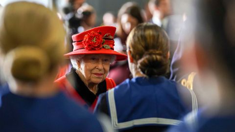 Britain's Queen Elizabeth II meets military personnel during her visit to the aircraft carrier HMS Queen Elizabeth in Portsmouth, southern England on May 22, 2021, ahead of its maiden operational deployment to the Philippine Sea.