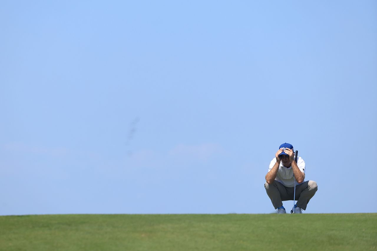 Kevin Streelman lines up a putt on the third green.