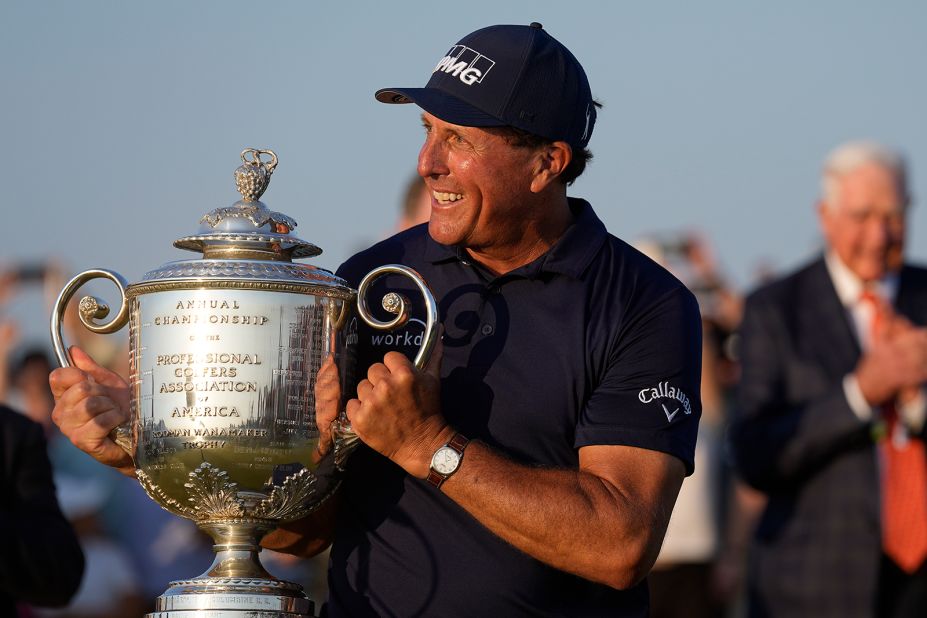 Phil Mickelson holds the Wanamaker Trophy after winning the PGA Championship golf tournament.
