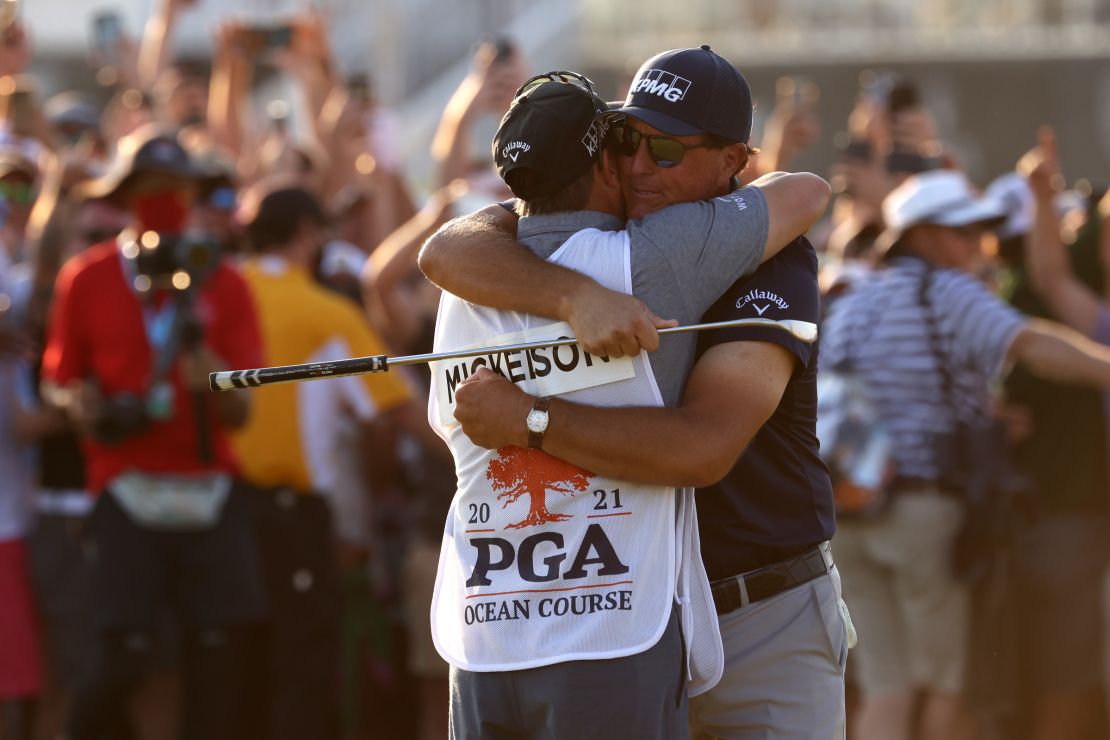 Mickelson celebrates with brother and caddie Tim Mickelson on the 18th green after winning during the 2021 PGA Championship.