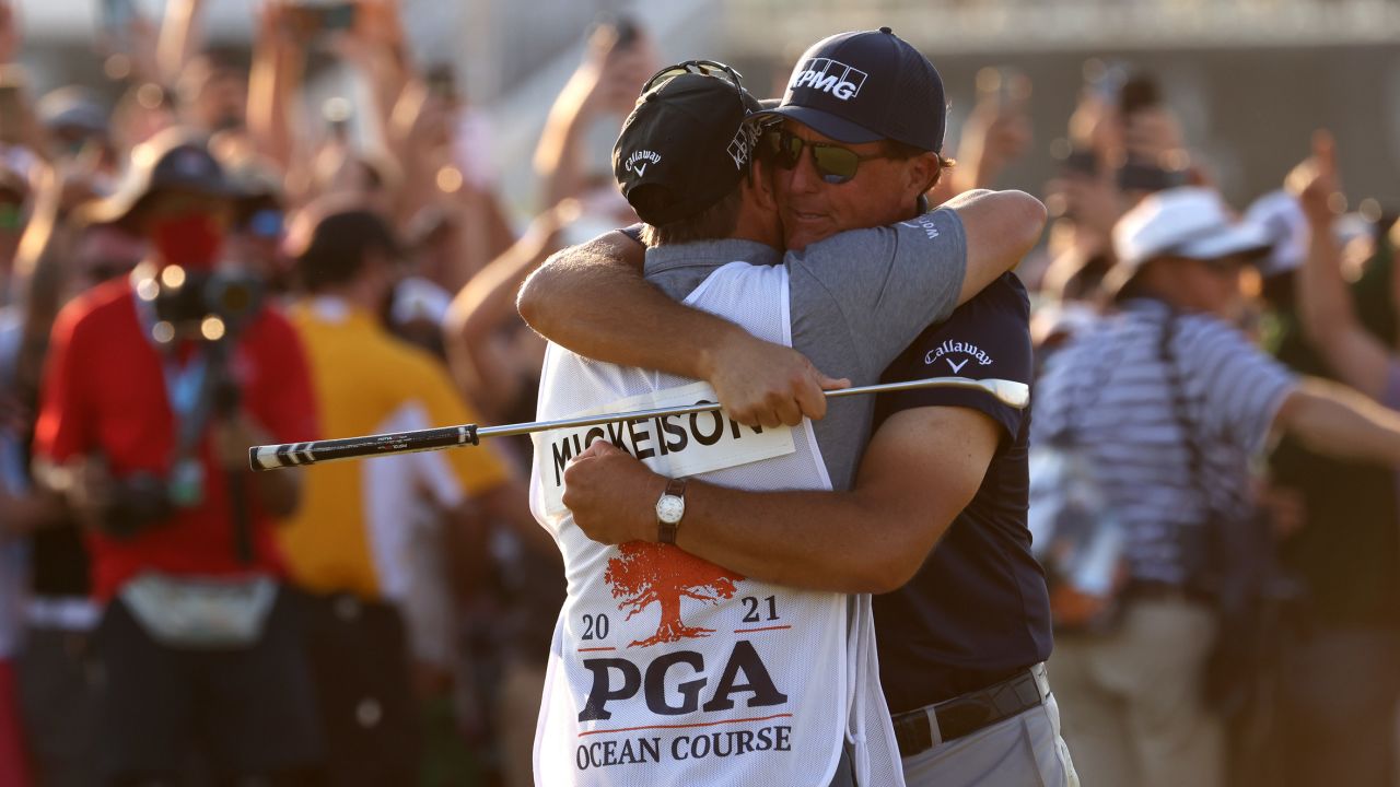 Mickelson celebrates with brother and caddie Tim Mickelson on the 18th green after winning during the 2021 PGA Championship.