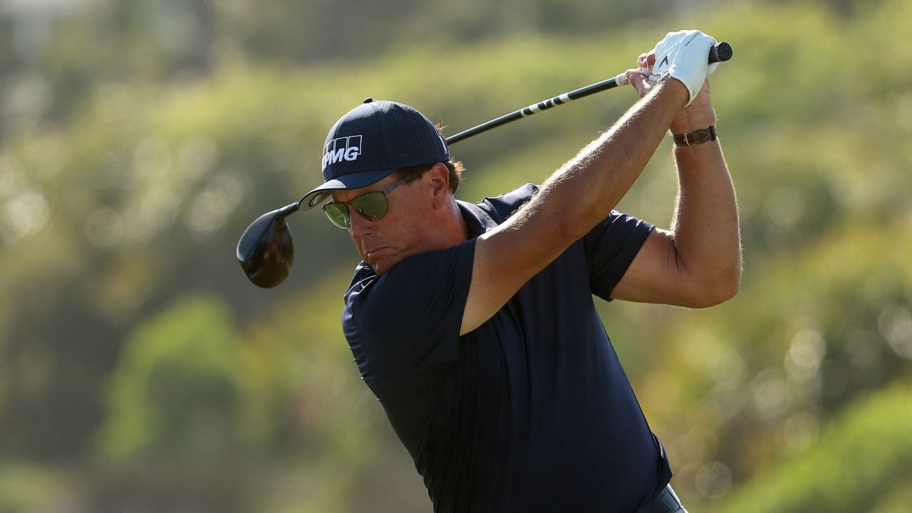Mickelson plays his shot from the 12th tee during the final round.