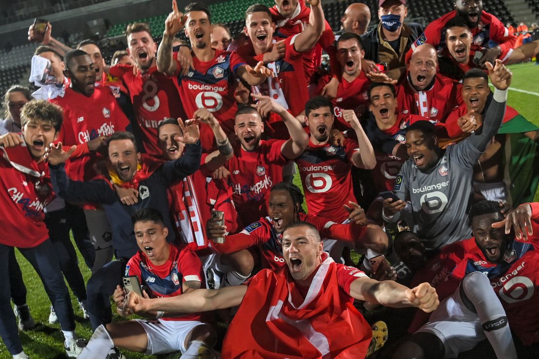 Lille's players celebrate after winning the Ligue 1 title.