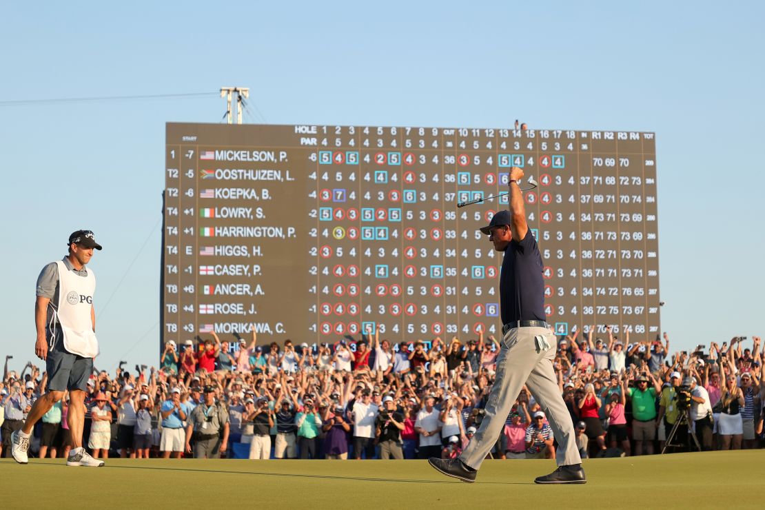 Mickelson celebrates on the 18th green after winning the 2021 PGA Championship.