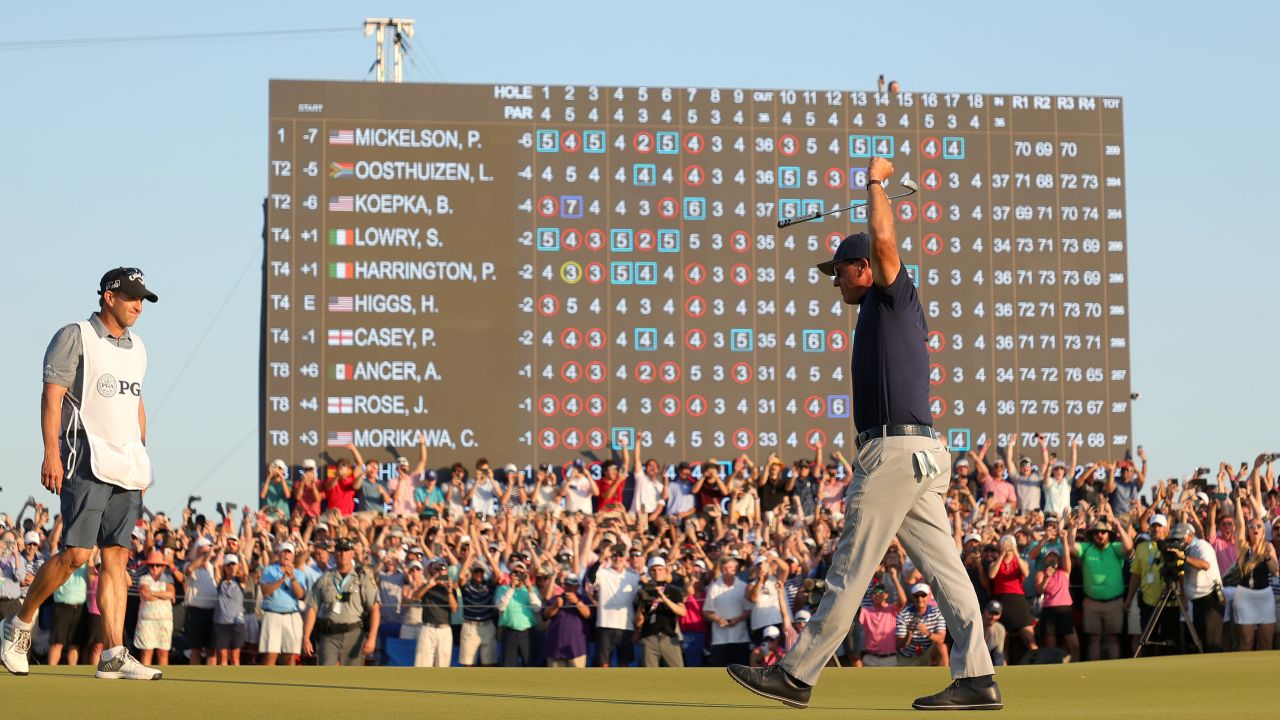 Mickelson celebrates on the 18th green after winning the 2021 PGA Championship.