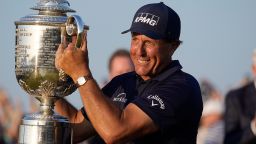Phil Mickelson holds the Wanamaker Trophy after winning the PGA Championship golf tournament on the Ocean Course, Sunday, May 23, 2021, in Kiawah Island, S.C. (AP Photo/David J. Phillip)