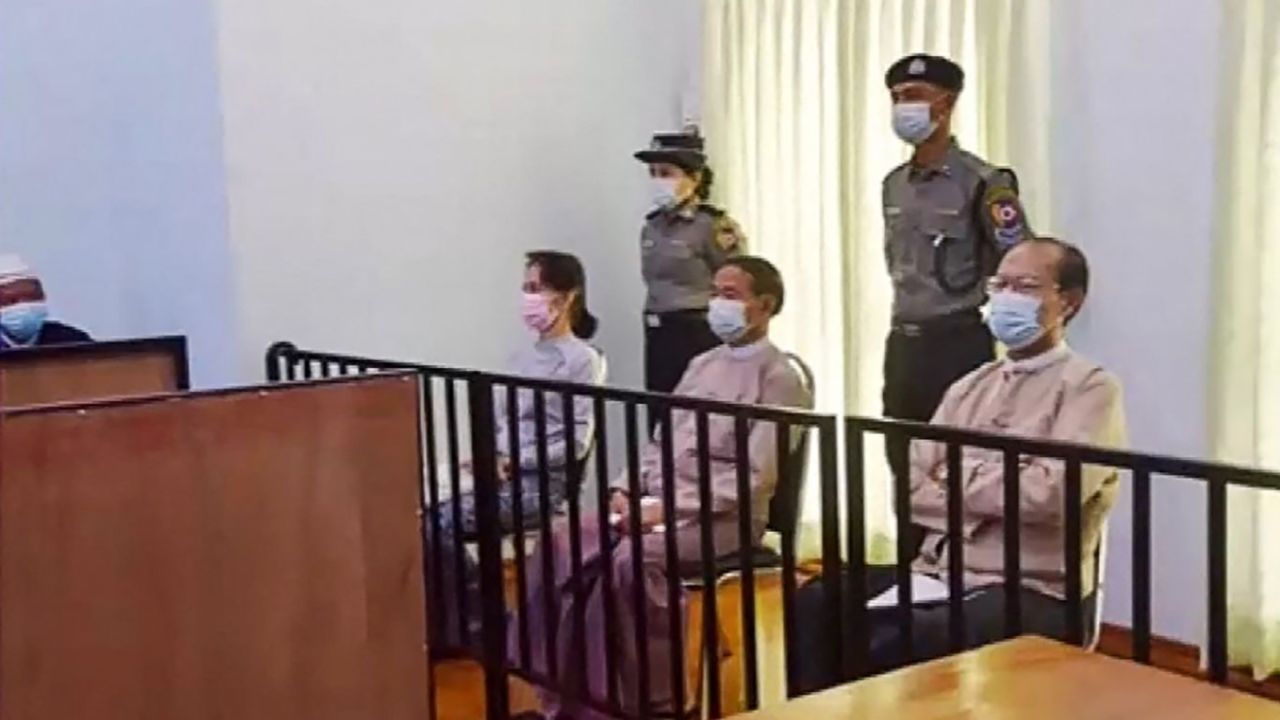 Detained civilian leader Aung San Suu Kyi (second from left) during her first court appearance in Naypyidaw on May 24.