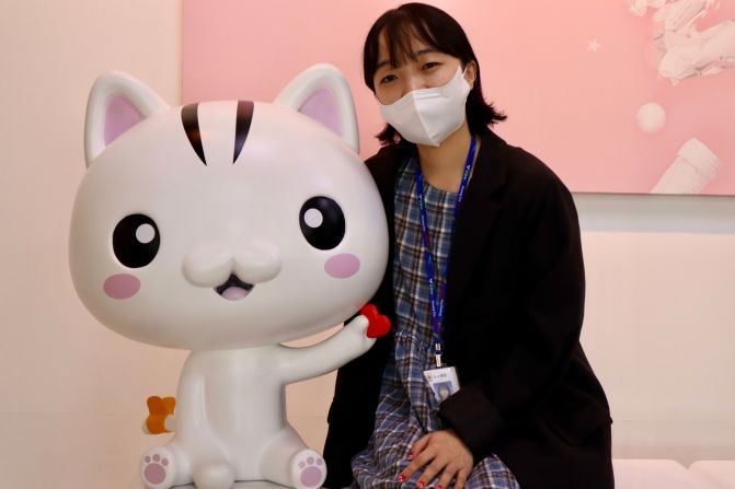 <strong>Making friends:</strong> Goyang city official Choi Seo-young poses with the Goyang-goyang-yi character. The city has become popular online and with tourists following the addition of the mascot.