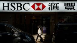 A pedestrian walks past a HSBC Holdings Plc bank branch in Hong Kong, China, on Monday, Jan. 25, 2021. HSBC's Chief Executive Officer Noel Quinn is set to appear before the U.K. Parliament Foreign Affairs Committee to answer questions over the lenders moves to freeze accounts of activists in Hong Kong, according to an exiled lawmaker. Photographer: Lam Yik/Bloomberg via Getty Images