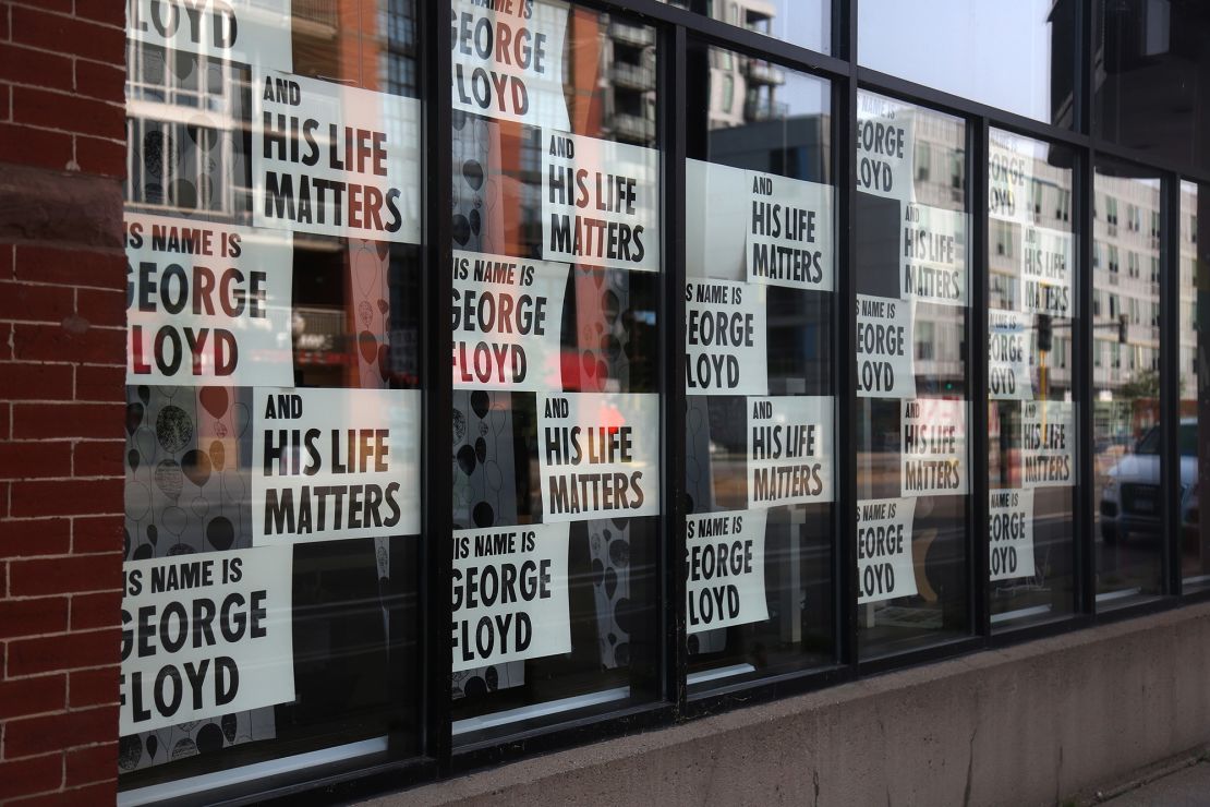 Signs remembering George Floyd are displayed outside a store in Minneapolis on Sept. 19, 2020.