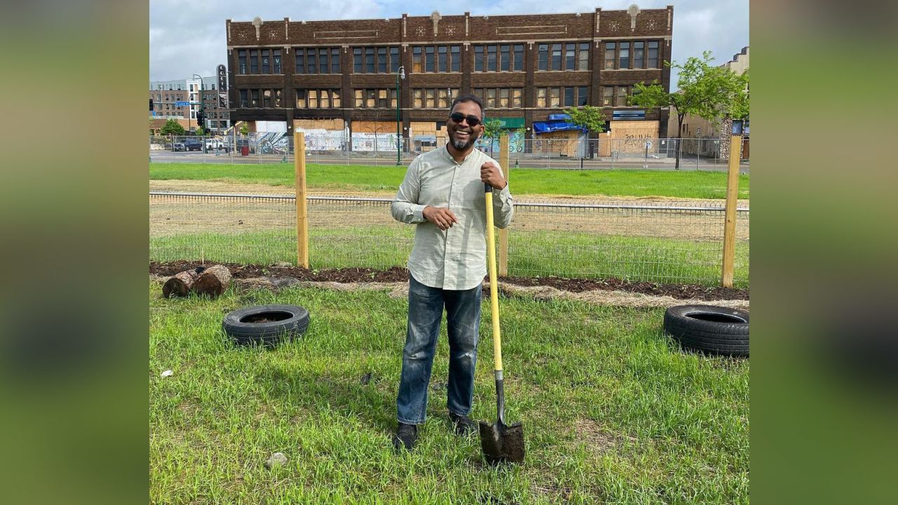 Restaurateur Ruhel Islam stands in an empty lot at 3009 27th Ave. S. in Minneapolis where he plans to rebuild his Gandhi Mahal restaurant, which was destroyed during riots over the police murder of George Floyd a year ago.